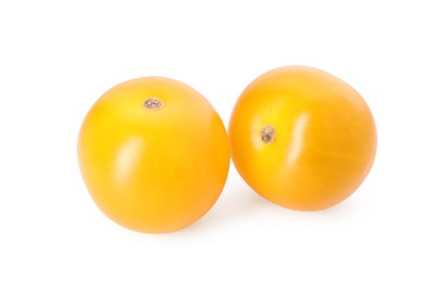 Photo of Two ripe yellow tomatoes isolated on white