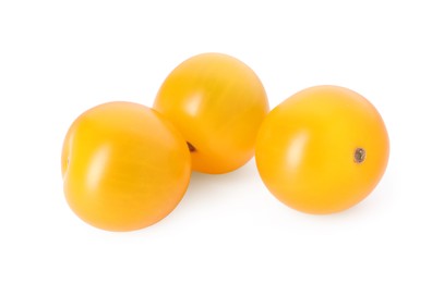 Photo of Three ripe yellow tomatoes isolated on white