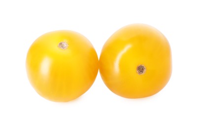 Photo of Two ripe yellow tomatoes isolated on white
