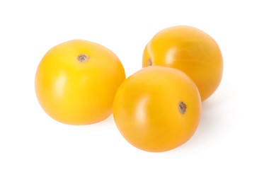 Photo of Three ripe yellow tomatoes isolated on white