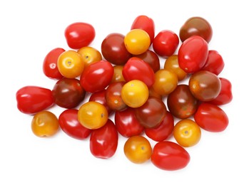 Photo of Heap of different ripe juicy tomatoes isolated on white, top view