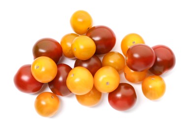 Photo of Heap of different ripe juicy tomatoes isolated on white, top view