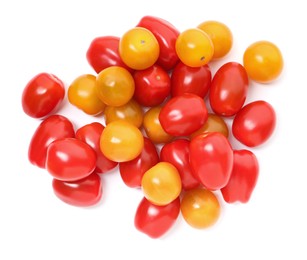 Photo of Heap of different ripe juicy tomatoes isolated on white, top view