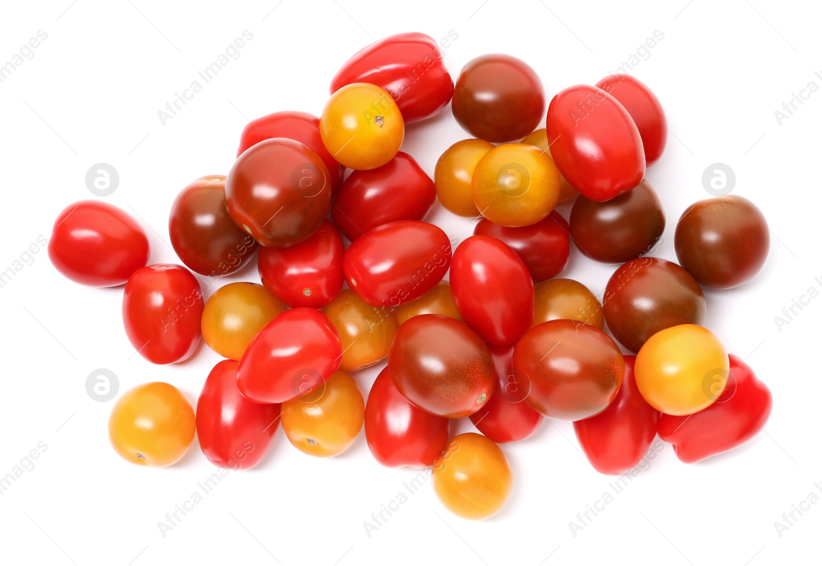 Photo of Heap of different ripe juicy tomatoes isolated on white, top view