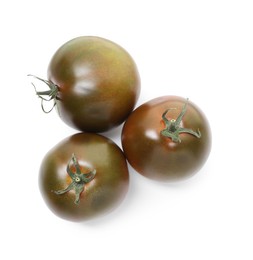 Photo of Ripe brown tomatoes isolated on white, top view