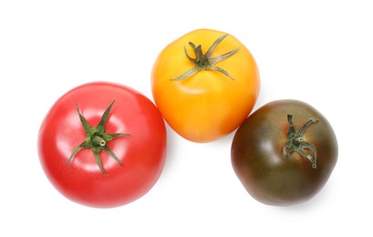 Photo of Different ripe juicy tomatoes isolated on white, top view