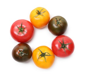 Photo of Different ripe juicy tomatoes isolated on white, top view