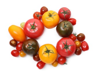 Photo of Different ripe juicy tomatoes isolated on white, top view