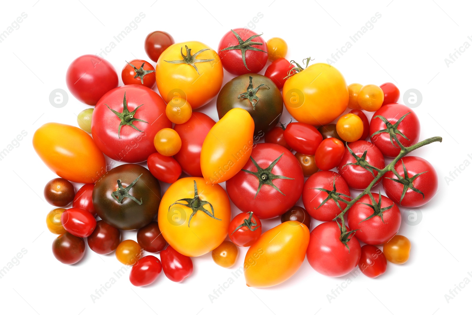 Photo of Heap of different ripe juicy tomatoes isolated on white, top view