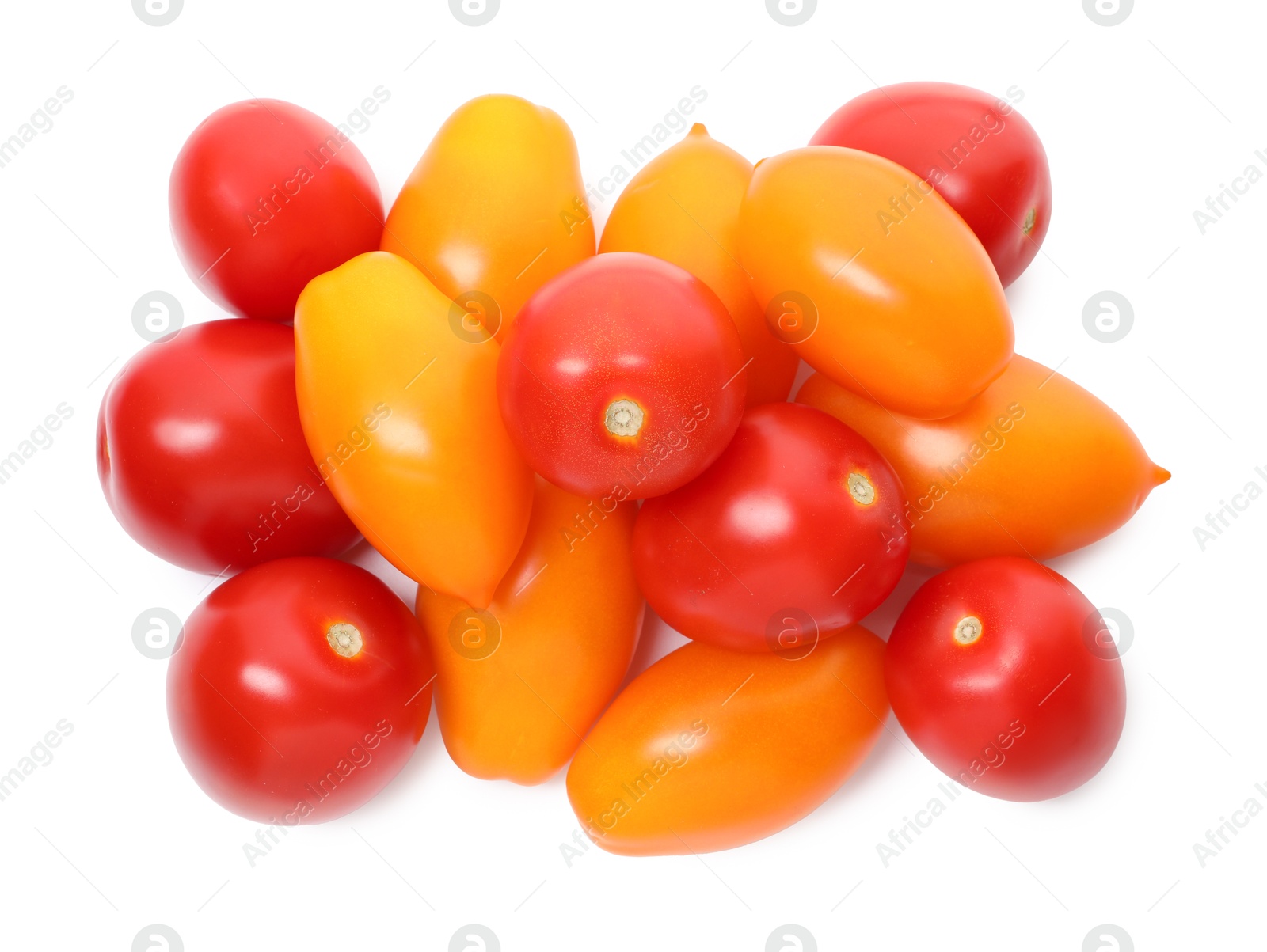 Photo of Heap of different ripe juicy tomatoes isolated on white, top view