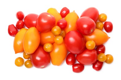 Photo of Heap of different ripe juicy tomatoes isolated on white, top view