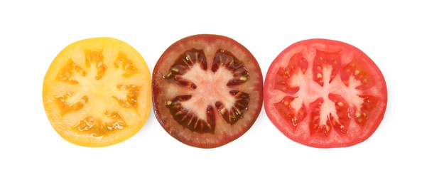 Photo of Pieces of different ripe juicy tomatoes isolated on white, top view