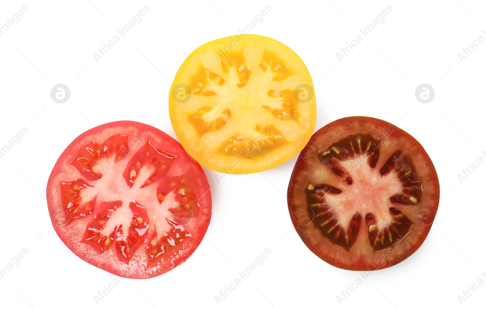 Photo of Pieces of different ripe juicy tomatoes isolated on white, top view