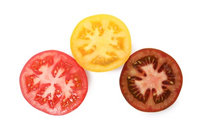Photo of Pieces of different ripe juicy tomatoes isolated on white, top view