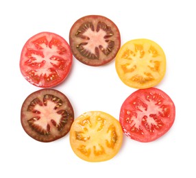 Photo of Pieces of different ripe juicy tomatoes isolated on white, top view