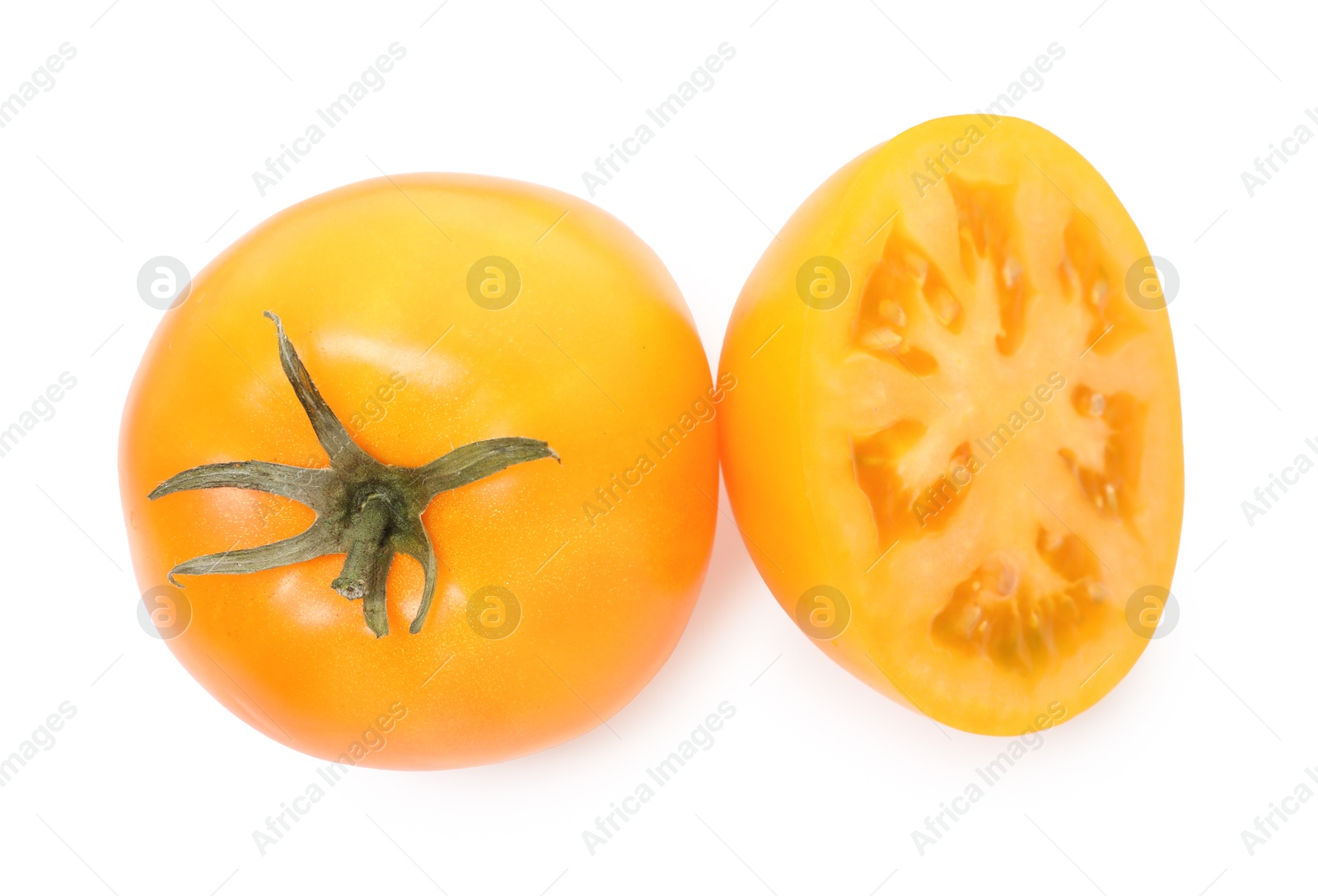 Photo of Whole and cut yellow tomatoes isolated on white, top view