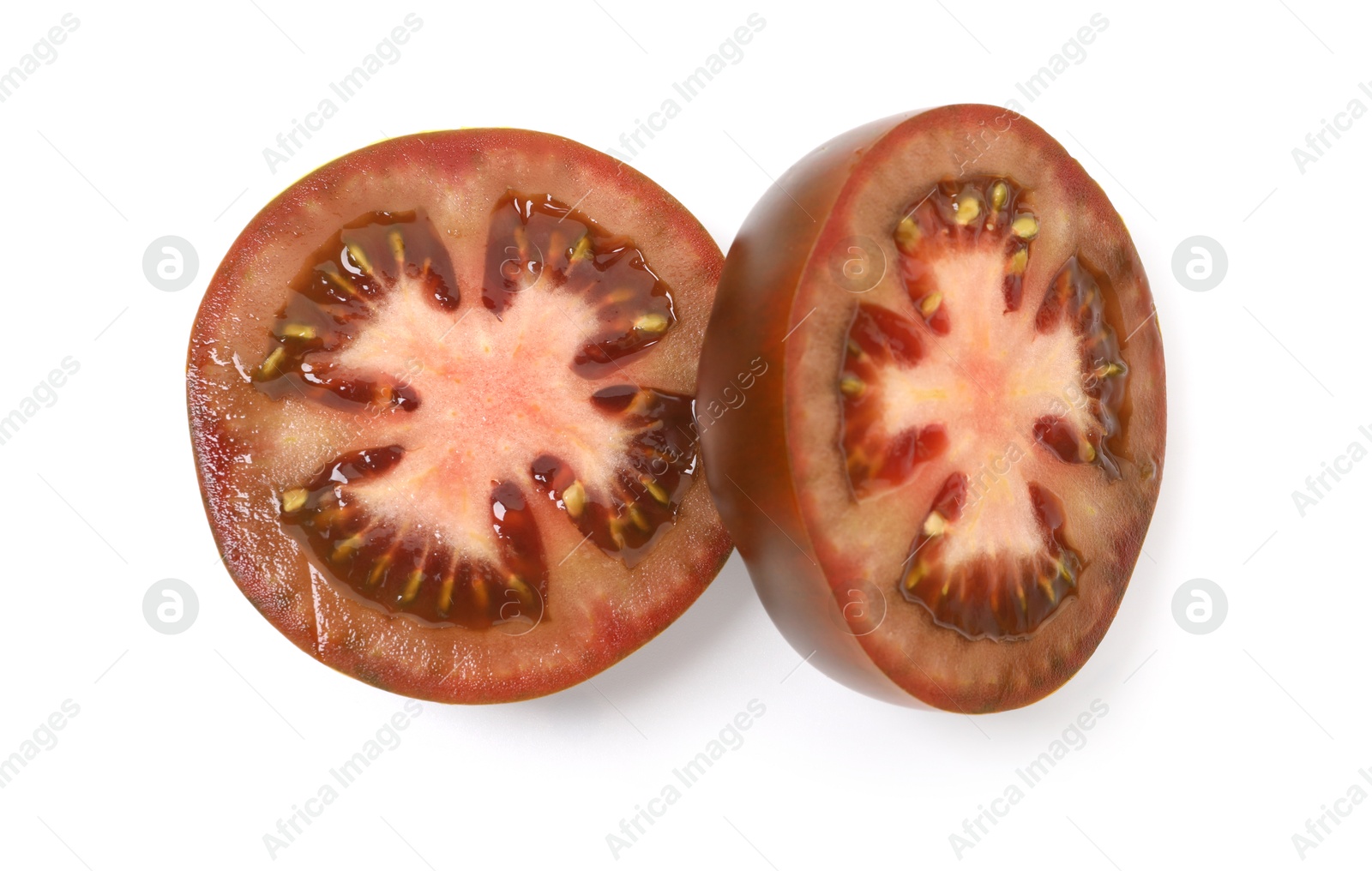 Pieces of brown tomatoes isolated on white, top view Photo of Pieces of brown tomatoes isolated on white, top view