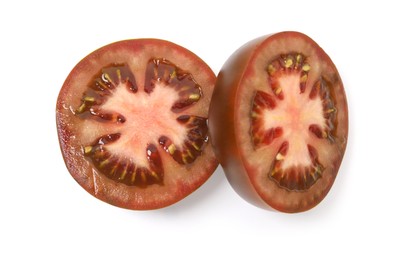 Photo of Pieces of brown tomatoes isolated on white, top view
