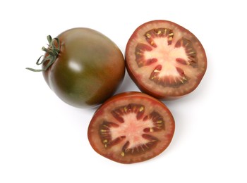 Photo of Whole and cut brown tomatoes isolated on white, top view