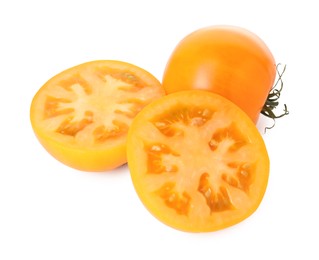 Photo of Whole and cut yellow tomatoes isolated on white