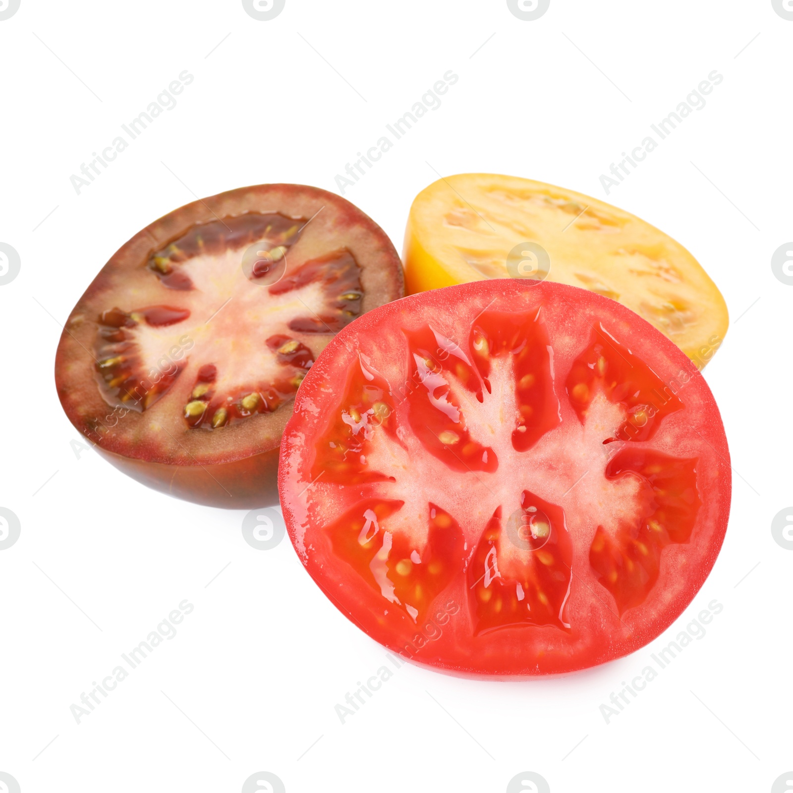 Photo of Pieces of different ripe juicy tomatoes isolated on white