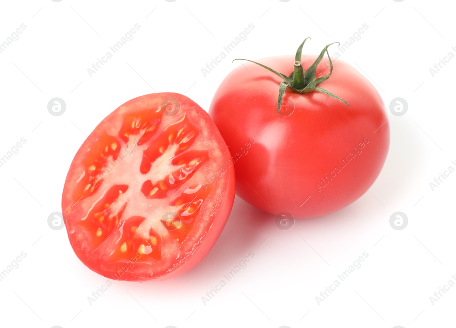 Photo of Whole and cut red tomatoes isolated on white