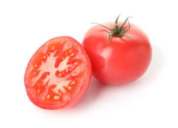 Photo of Whole and cut red tomatoes isolated on white