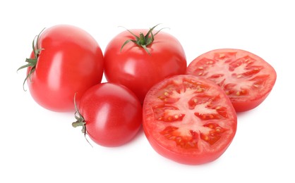 Photo of Many ripe red tomatoes isolated on white