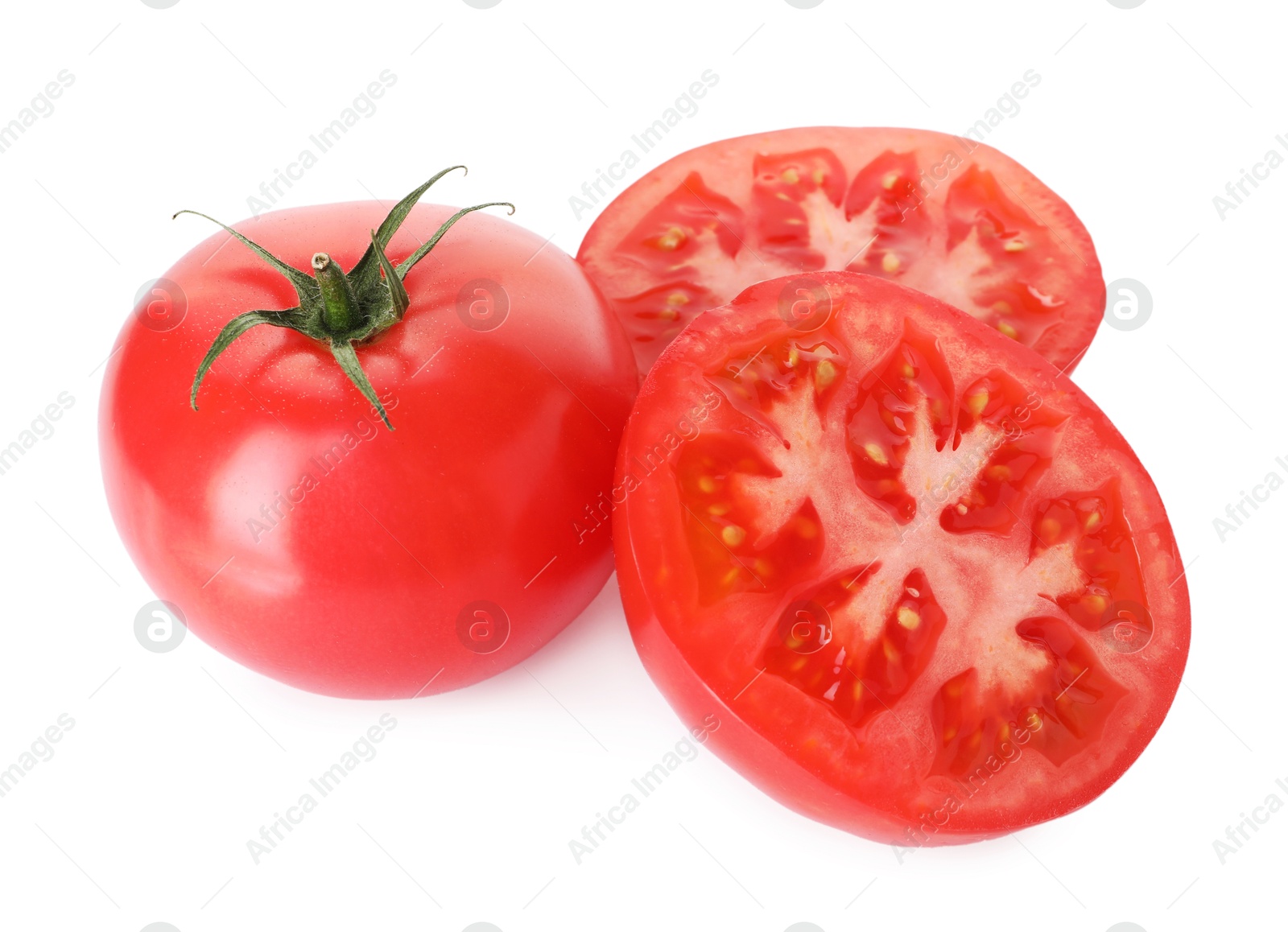 Whole and cut red tomatoes isolated on white Photo of Whole and cut red tomatoes isolated on white