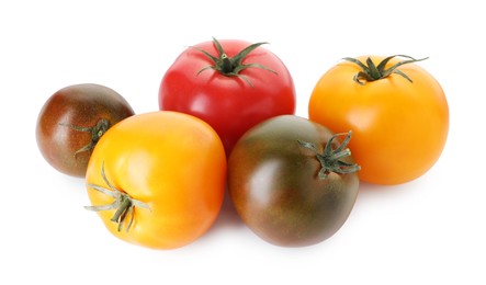 Photo of Different ripe juicy tomatoes isolated on white