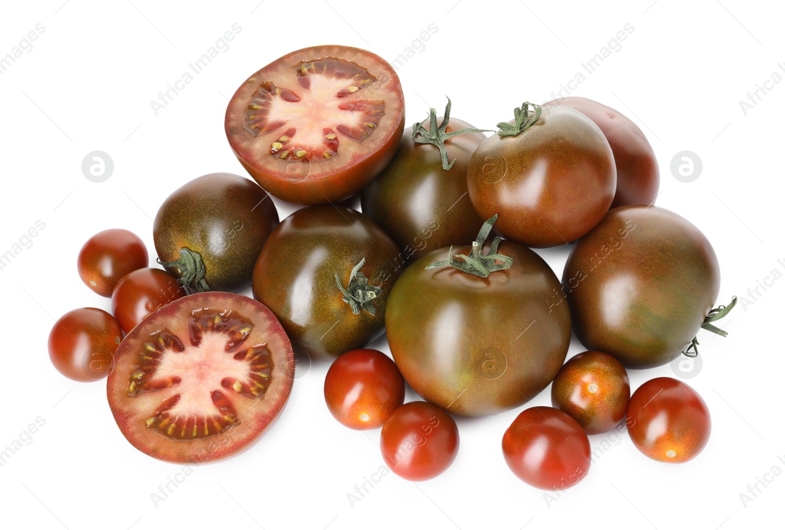 Photo of Heap of different ripe juicy tomatoes isolated on white