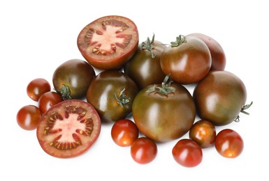 Photo of Heap of different ripe juicy tomatoes isolated on white