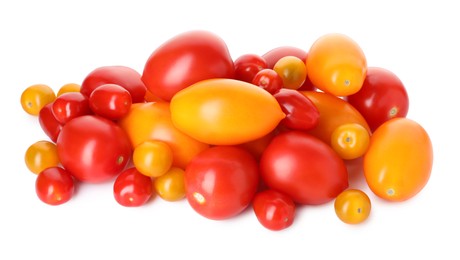 Photo of Heap of different ripe juicy tomatoes isolated on white