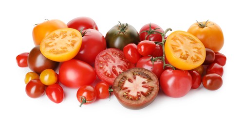 Photo of Heap of different ripe juicy tomatoes isolated on white