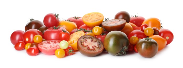 Photo of Heap of different ripe juicy tomatoes isolated on white