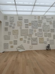 Photo of Wassenaar, Netherlands - June 28, 2025: Installation of blank canvases on wall at Voorlinden museum
