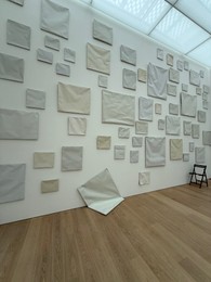 Photo of Wassenaar, Netherlands - June 28, 2025: Installation of blank canvases on wall at Voorlinden museum