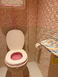 Photo of Wassenaar, Netherlands - June 28, 2025: Installation with bathroom made of candies at Voorlinden museum