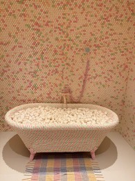 Photo of Wassenaar, Netherlands - June 28, 2025: Installation with bathroom made of candies at Voorlinden museum
