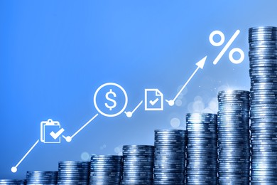 Image of Percent signs, icons and arrow above stacked coins against blue gradient background