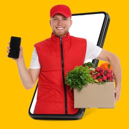 Image of Delivery service worker giving online order out of mobile phone against orange background. Man with box full of food products and smartphone
