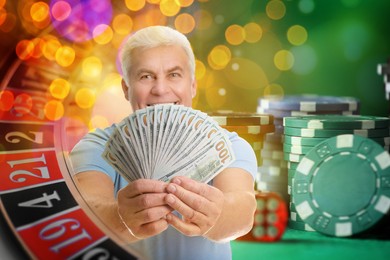 Image of Happy gambler showing fan of money. Multiple exposure with roulette, casino chips and dice