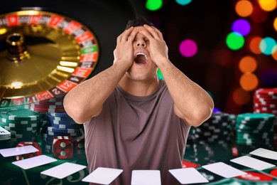 Image of Emotional gambler, multiple exposure with casino chips, dice, playing cards and roulette