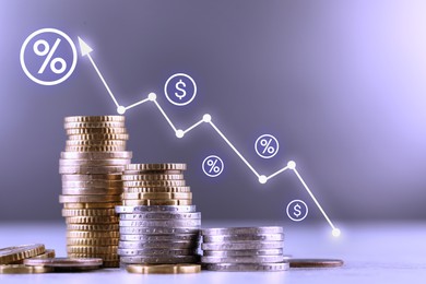 Image of Percent signs, icons and arrow above stacked coins against grey background