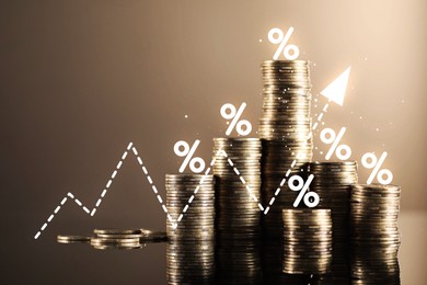 Image of Percent signs and arrow above stacked coins against dark beige background