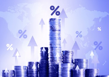 Image of Percent signs, arrows and stacked coins against world map, color toning