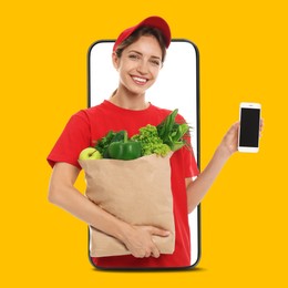 Image of Delivery service worker giving online order out of mobile phone against orange background. Woman with paper bag full of food products and smartphone