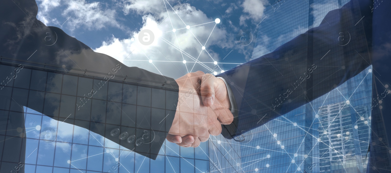 Image of Business people shaking hands, double exposure with buildings. Success in partnership, deal, agreement. Banner design
