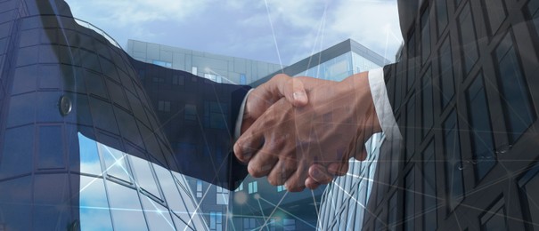 Image of Business people shaking hands, double exposure with buildings. Success in partnership, deal, agreement. Banner design