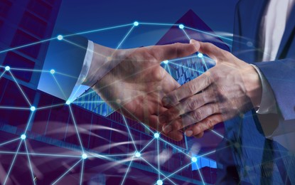 Image of Business people shaking hands, double exposure with buildings. Success in partnership, deal, agreement